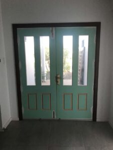 teal door before